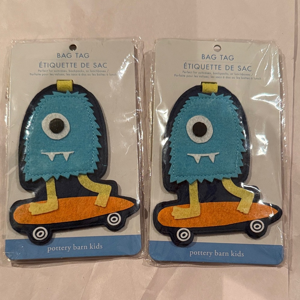 Two Pottery Barn Kids Blue and Orange mudpuppy Bag Tags